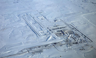 Aerial view of an airport covered in snow.