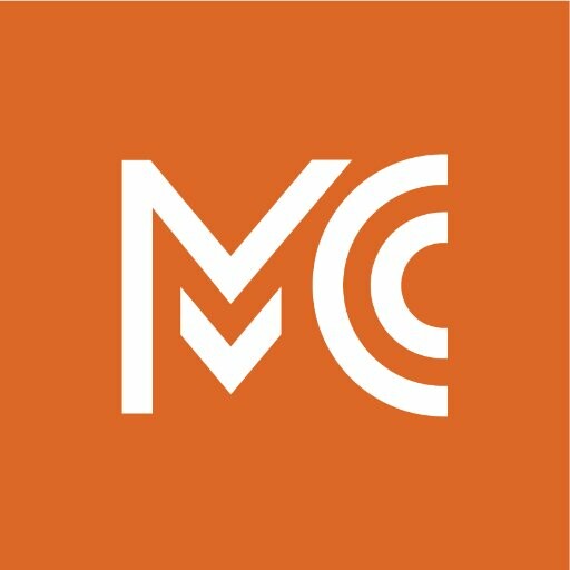 orange background with white text M C