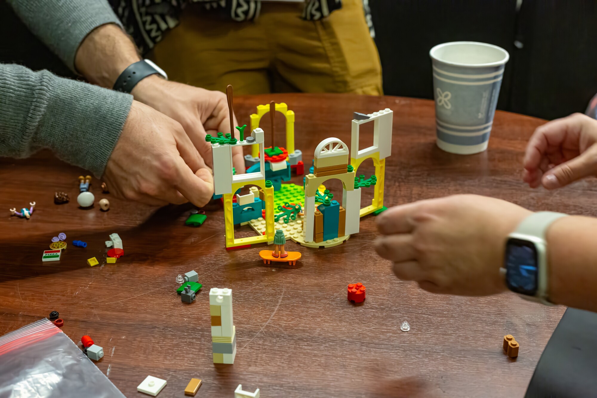 Colaboratorio participants build a LEGO set together.